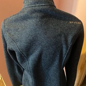 Spyder Blue Ski Jacket with High Collar and Textured Fabric